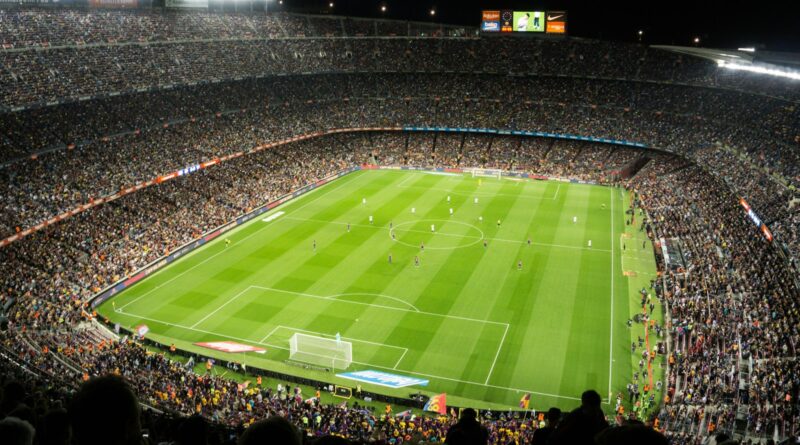 Floodlit football stadium at kickoff, illustrating the 2026 FA Community Shield between Arsenal and Manchester City in Cardiff