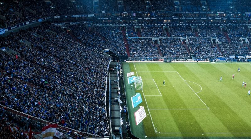 A packed football stadium filled with fans before kickoff, evoking the big-match atmosphere of the 2026 FA Community Shield between Arsenal and Manchester City in Cardiff