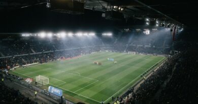 Football stadium under floodlights at night ahead of the 2026 Premier League transfer deadline day